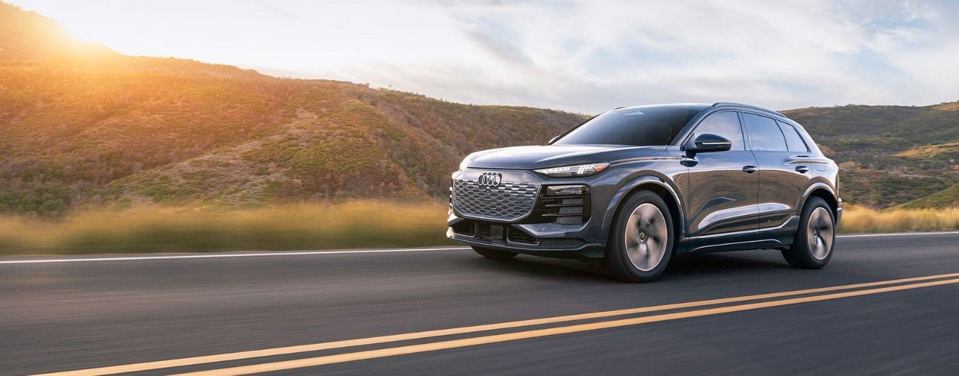 grey 2025 Audi Q6 e-tron driving to an Audi dealer near Lexington